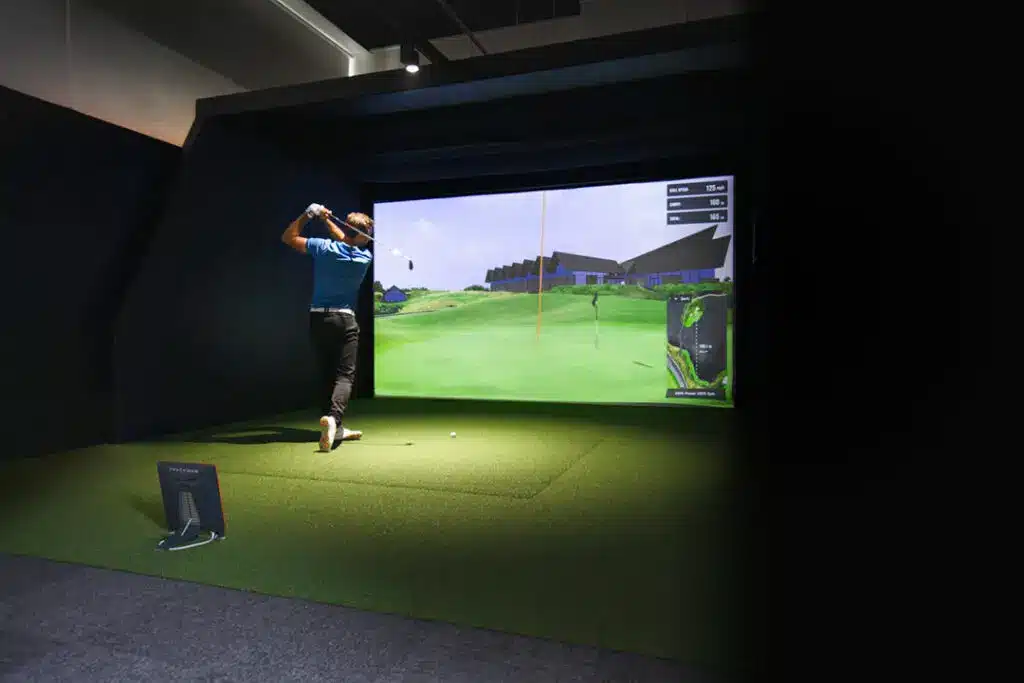 Heritage Garden Studios Golf Simulator Room Player swinging in SIM 72 dpi