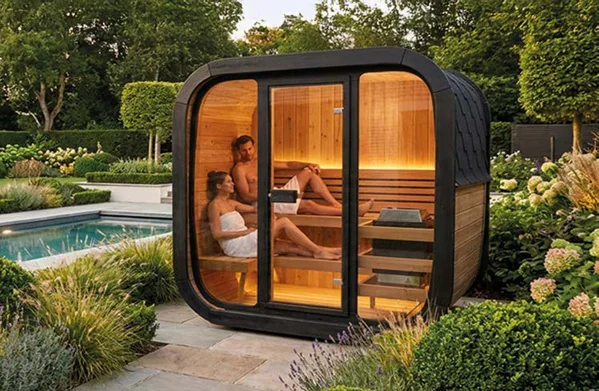 Couple relaxing in a modern sauna.