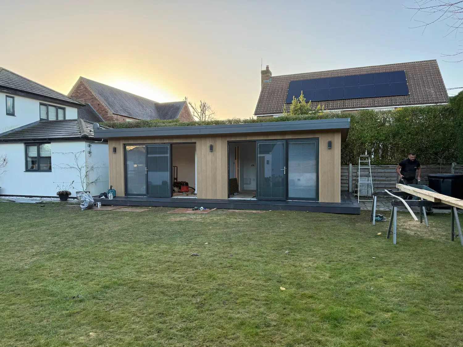 sips garden studio installation timber cladding anthracite doors