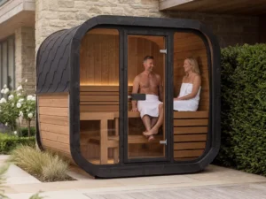 Couple relaxing inside luxury outdoor sauna with warm timber interior and ambient lighting