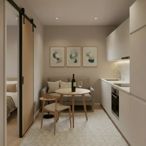 Kitchen and dining area inside The Kingsley luxury lodge by Heritage Lodges featuring modern kitchenette, dining table and compact seating area